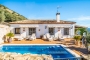 Pool area with sunloungers and awnings